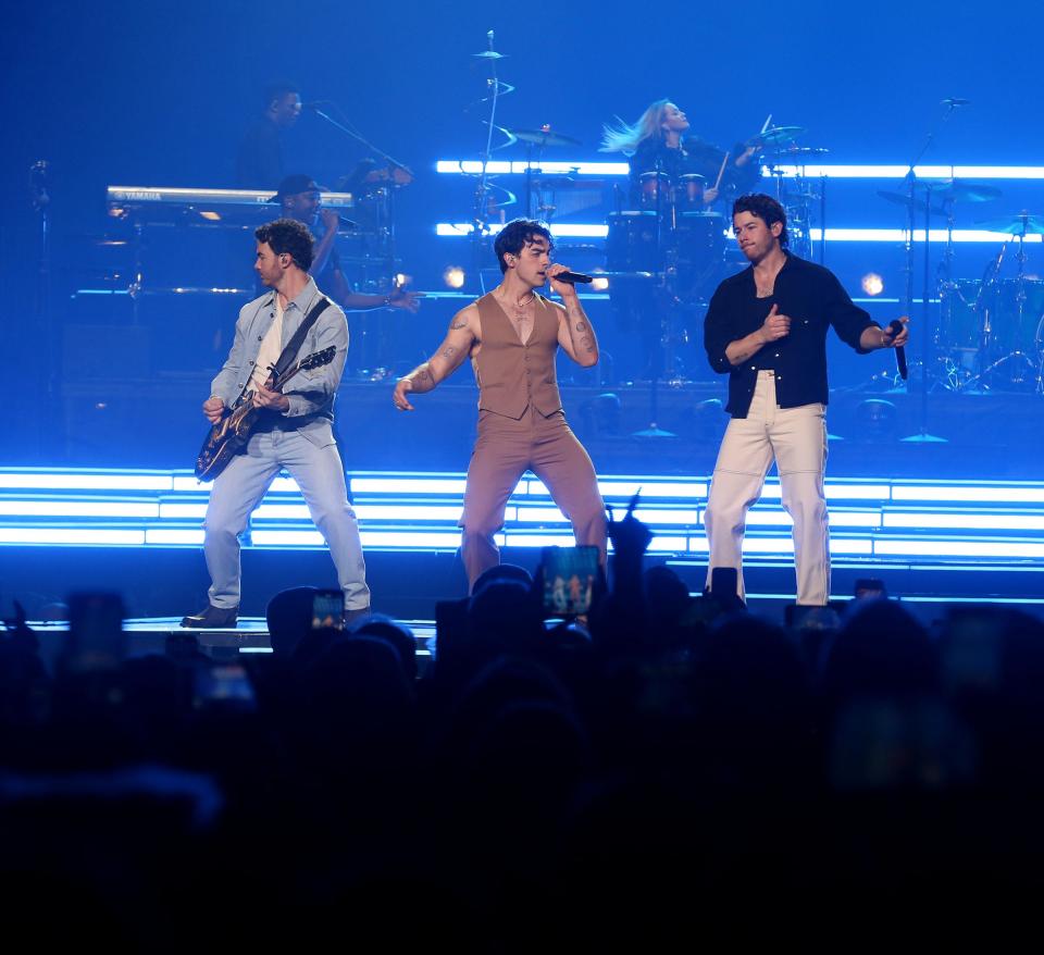 The Jonas Brothers - Kevin (left to right), Joe and Nick - perform Dec. 6 at Prudential Center in Newark.
