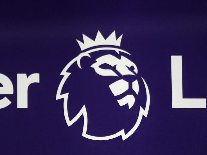 The Premier League logo is pictured through a glass window: AFP via Getty Images