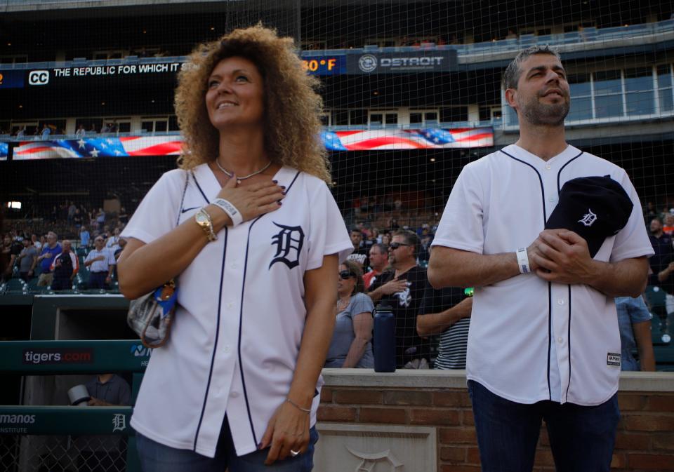 Detroit Symphony Orchestra music director Jader Bignamini (right) and his assistant, Stefania Gamba, stand on field before a Detroit Tigers game at Comerica Park on June 14, 2022.