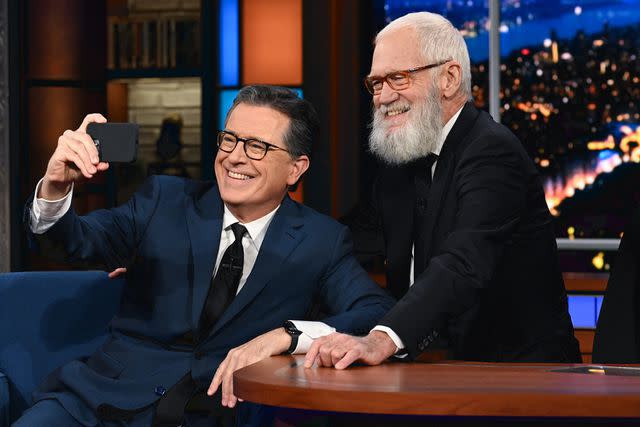 <p>Scott Kowalchyk/CBS</p> Stephen Colbert and guest David Letterman take a selfie.