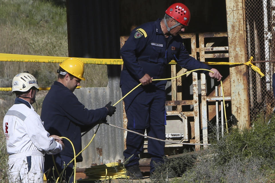 Cypriot special Rescue Forces loaded a special camera inside a flooded mineshaft where two female bodies were found, outside of Mitsero village near capital Nicosia, Cyprus, Monday, April 22, 2019. Police on the east Mediterranean island nation, along with the help of the fire service, are conducting the search Monday in the wake of last week's discovery of the bodies in the abandoned mineshaft and the disappearance of the six year-old daughter of one of the victims. (AP Photo/Petros Karadjias)