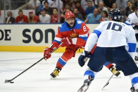 Sep 22, 2016; Toronto, Ontario, Canada; Team Russia forward Alex Ovechkin (8) moves the puck toward Team Finland defenseman Sami Lepisto (18) during preliminary round play in the 2016 World Cup of Hockey at Air Canada Centre. Mandatory Credit: Dan Hamilton-USA TODAY Sports