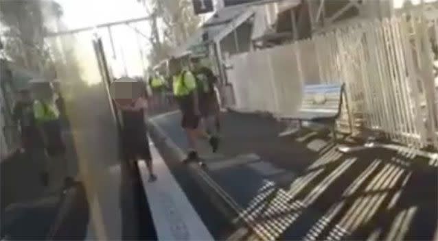 A passenger yells for the woman to get off the train. Source: Facebook