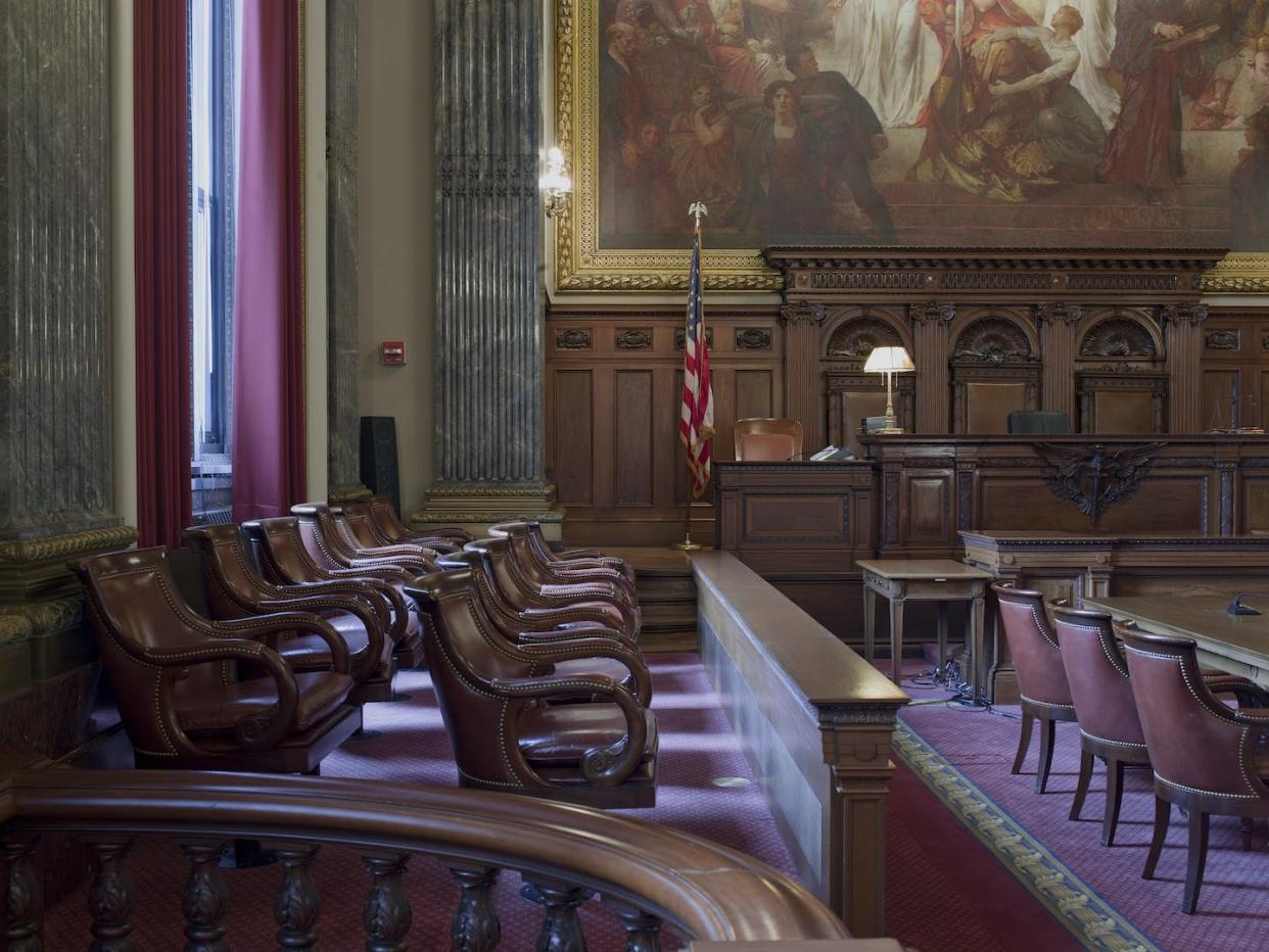 A judge bench and a jury box are seen in a U.S. courthouse in Cleveland, Ohio. <a href="https://media.gettyimages.com/id/564093673/photo/east-courtroom-judge-bench-and-jury-box-howard-m-metzenbaum-u-s-courthouse-cleveland-ohio.jpg?s=1024x1024&w=gi&k=20&c=odacBdzPHvUBQHg-tFIbT2PJdGT5QZ9j63-HX4Yh_I8=" rel="nofollow noopener" target="_blank" data-ylk="slk:Carol M. Highsmith/Buyenlarge/Getty Images;elm:context_link;itc:0;sec:content-canvas" class="link ">Carol M. Highsmith/Buyenlarge/Getty Images</a>