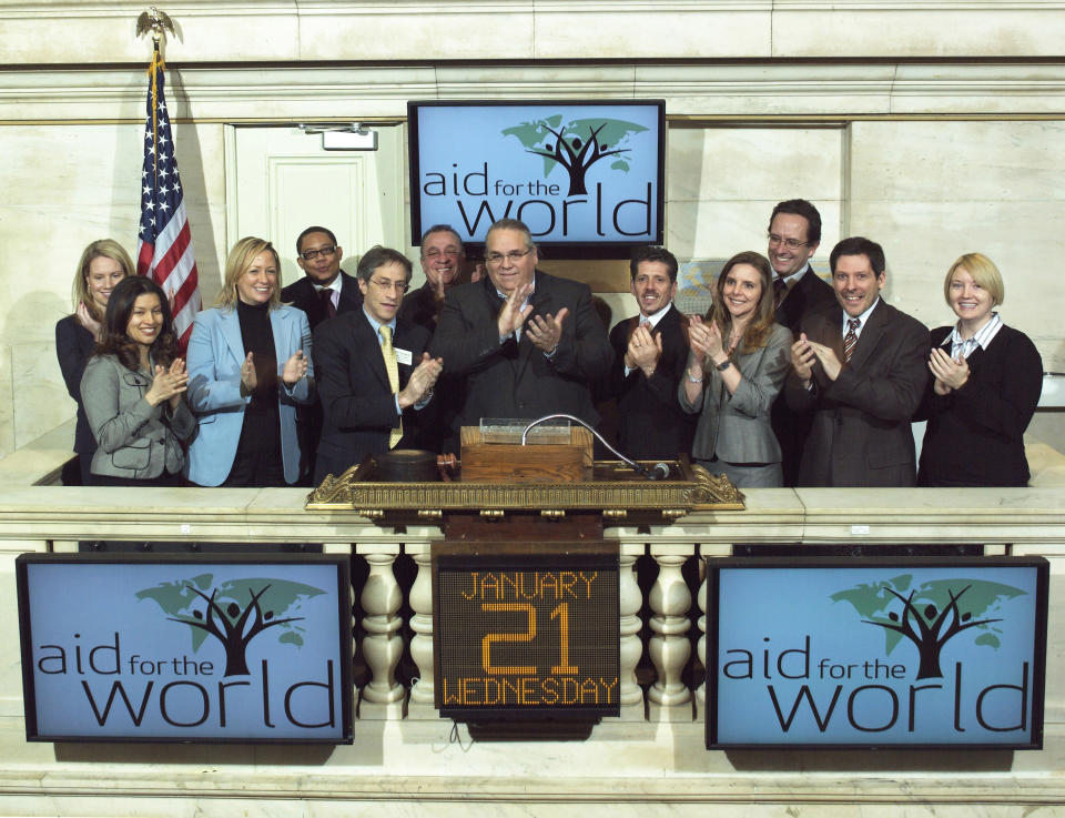 FILE - In this Jan. 21, 2009 photo provided by the New York Stock Exchange, Rev. Carl Keyes, founder of Aid for the World, rings the opening bell at the New York Stock Exchange. On Wednesday, May 14, 2014, Keyes and his wife, Donna, two New York City ministers who were the subject of an Associated Press expose, have agreed to pay $1.2 million to resolve allegations that they used congregation funds to enrich themselves and buy a luxury home. (AP Photo/NYSE)