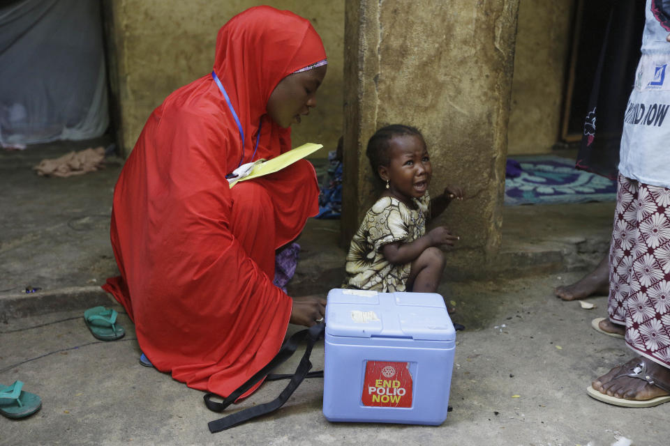 FILE - A child cries after she was administered with a polio vaccine during a house to house vaccination exercise in Maiduguri, Nigeria, Aug. 28, 2016. In a surprising twist in the decades-long effort to eradicate the virus, authorities in Jerusalem, New York and London have discovered evidence that polio is spreading there. The source of the virus? The oral vaccine itself. For years, global health officials have used an oral vaccine in an attempt to wipe out polio from its last remaining strongholds in countries including Afghanistan, Pakistan and Nigeria. (AP Photo/Sunday Alamba, File)