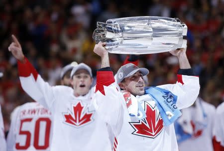 Sep 29, 2016; Toronto, Ontario, Canada; Team Canada center Brad Marchand (63) hoists the championship trophy after game two of the World Cup of Hockey final against Team Europe at Air Canada Centre. Mandatory Credit: Kevin Sousa-USA TODAY Sports