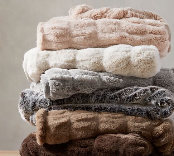 7) Faux Fur Ruched Throws