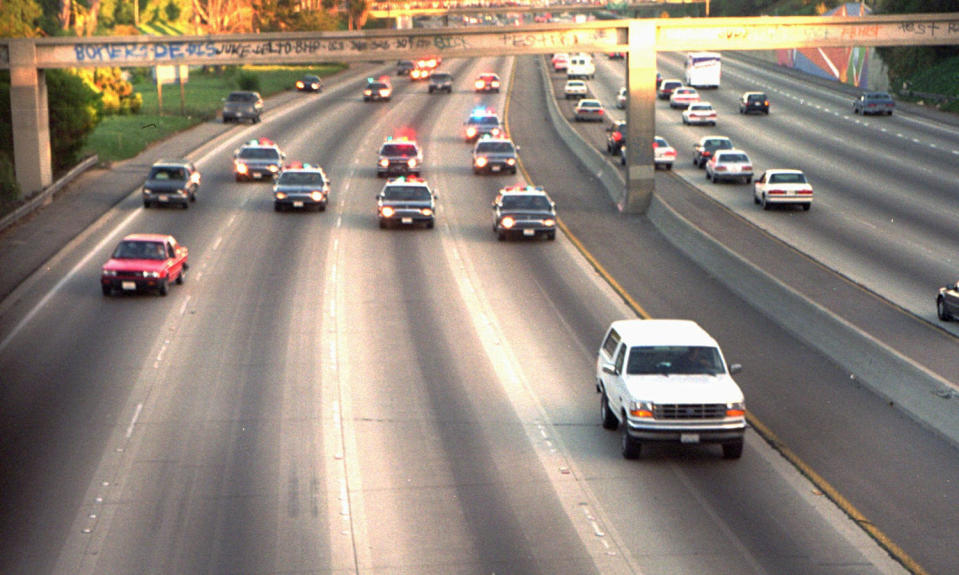 A white Ford Bronco, driven by Al Cowlings and carrying O.J. Simpson, is trailed by police cars as it travels on a southern California freeway in Los Angeles on June 17, 1994. (Joseph R. Villarin / AP file)