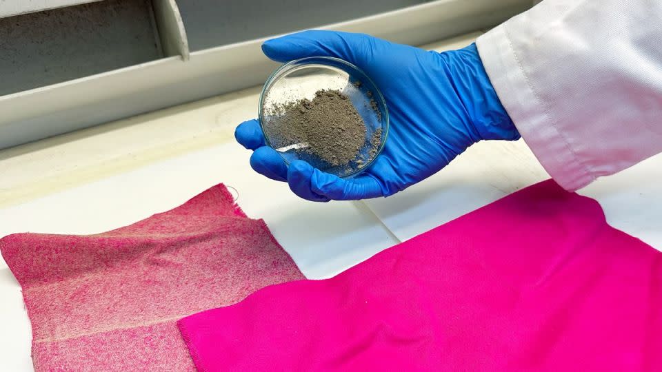 A sample of the treated fabric (L) used in the RMIT University study, next to a sample of untreated fabric (R), with a researcher holding a dish of nanodiamonds. - Cherry Cai/RMIT University