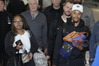 CORRECTS DATE - Los Angeles Dodgers outfielder Mookie Betts, right, walks with his wife, Brianna Betts, left, during the baseball team's arrival at Incheon International Airport, Friday, March 15, 2024, in Incheon, South Korea, ahead of the team's baseball series against the San Diego Padres. (AP Photo/Lee Jin-man)