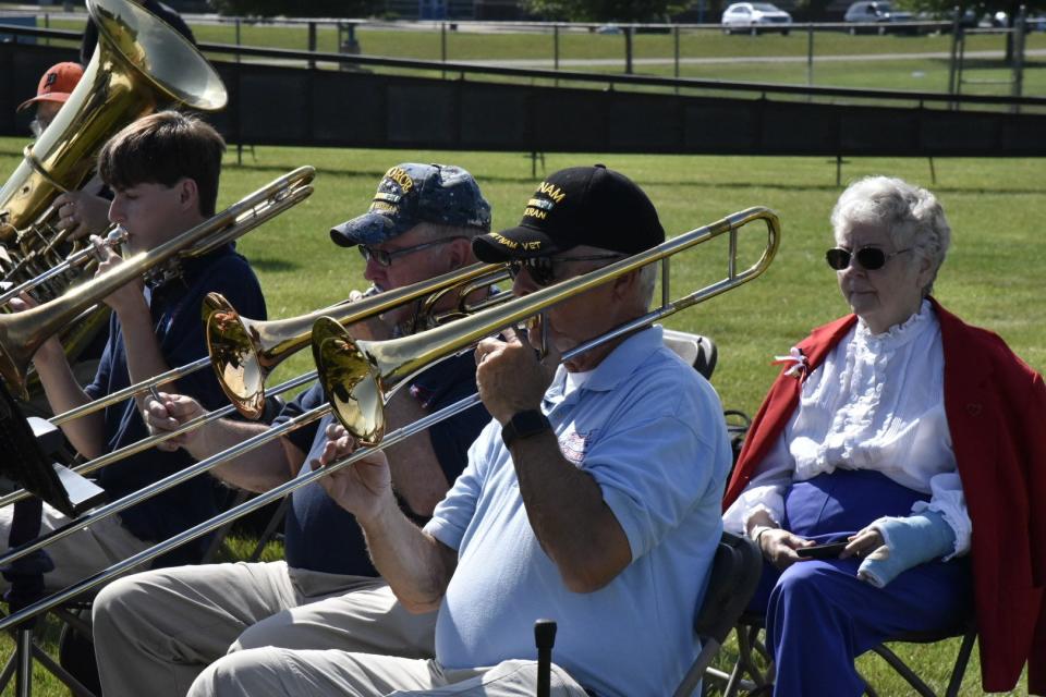 The Cereal City Concert Band performs during the opening ceremony for The Wall That Heals Vietnam Veterans Memorial Replica at Harper Creek Community Schools in Emmett Township on Thursday, July 14, 2022.