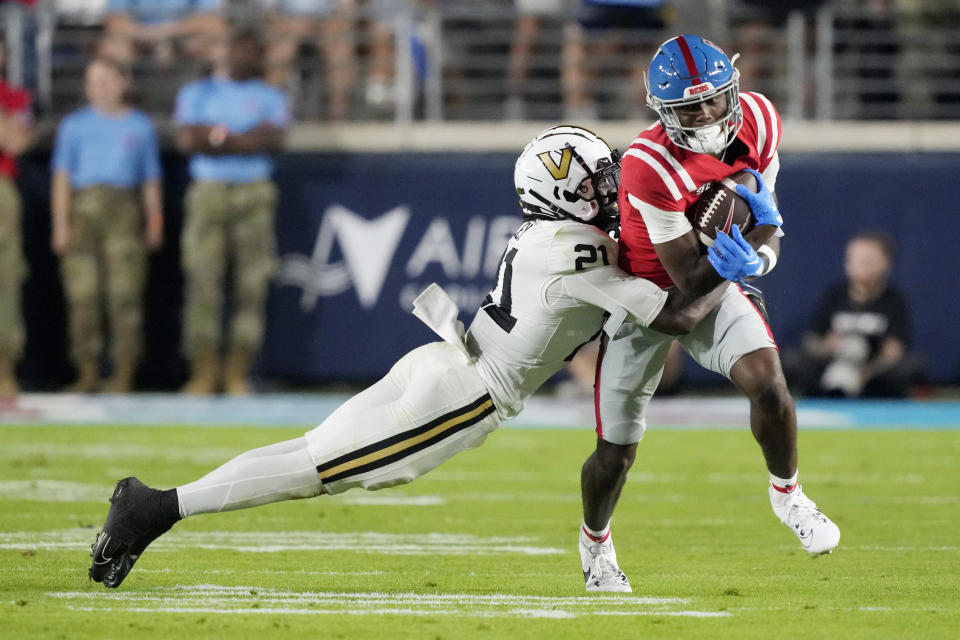 Mississippi wide receiver Ayden Williams, right, is tackled by Vanderbilt safety Savion Riley (21) during the second half of an NCAA college football game in Oxford, Miss., Saturday, Oct. 28, 2023. (AP Photo/Rogelio V. Solis)