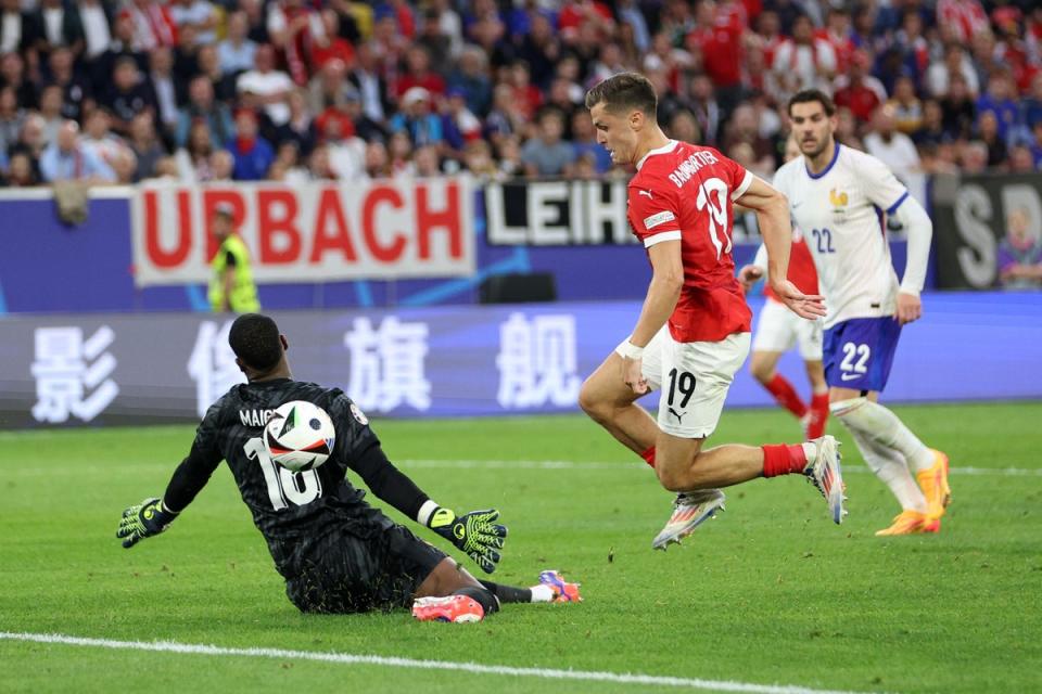 Christoph Baumgartner is denied by France goalkeeper Mike Maignan (Getty Images)