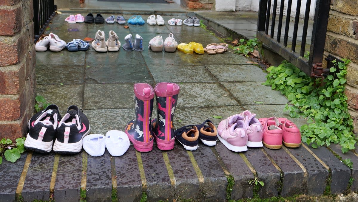 Rows of children’s shoes in front of the Labour leader’s door (Youth Demand/PA Wire)
