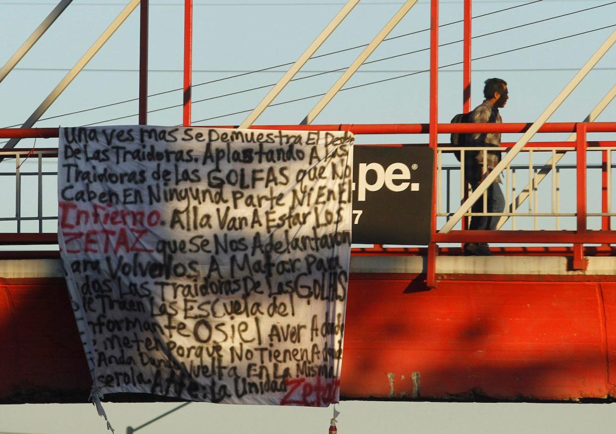 Mexico Monterrey bridge sign narcomanta Zetas crime scene