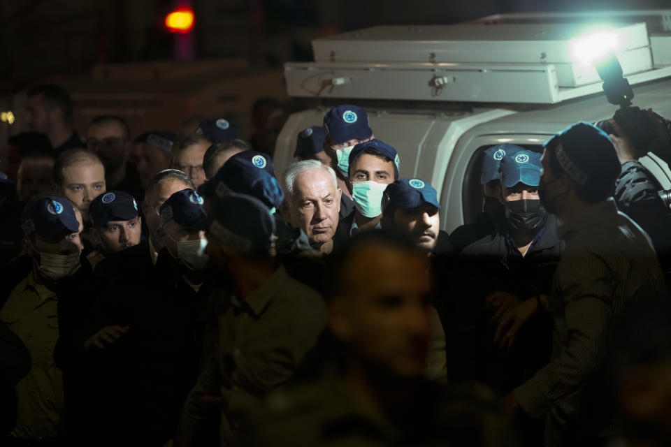 Israeli Prime Minister Benjamin Netanyahu visits the site of a shooting attack near a synagogue in Jerusalem, Friday, Jan. 27, 2023. A Palestinian gunman opened fire outside an east Jerusalem synagogue Friday night, killing seven people, including a 70-year-old woman, and wounding three others before police shot and killed him, officials said. It was the deadliest attack on Israelis in years and raised the likelihood of further bloodshed. (AP Photo/Maya Alleruzzo)