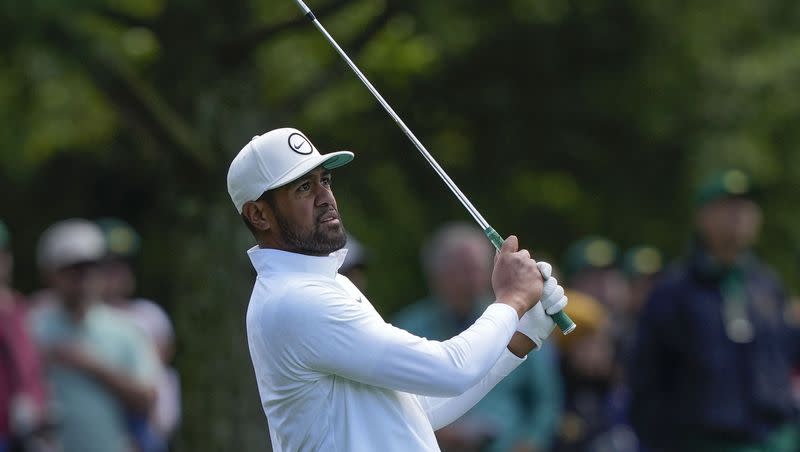 Tony Finau hits from the fairway on the eighth hole during the final round of the Masters golf tournament at Augusta National Golf Club on Sunday, April 9, 2023, in Augusta, Ga. (AP Photo/David J. Phillip)
