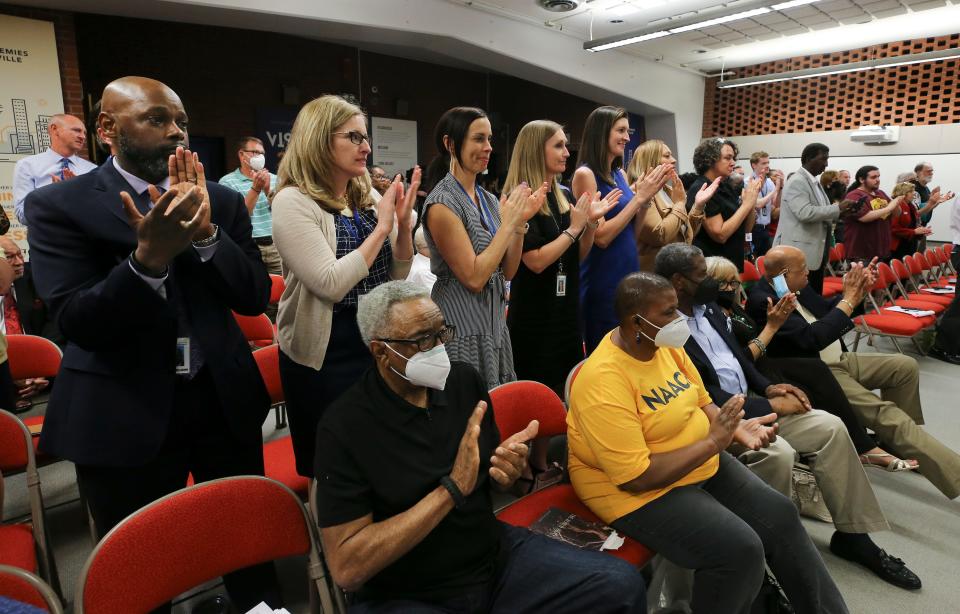 The audience applauded as the Jefferson County Public Schools Board of Education voted unanimously to overhaul the student assignment plan at the Vanhoose Education Center in Louisville, Ky. on June 1, 2022. 