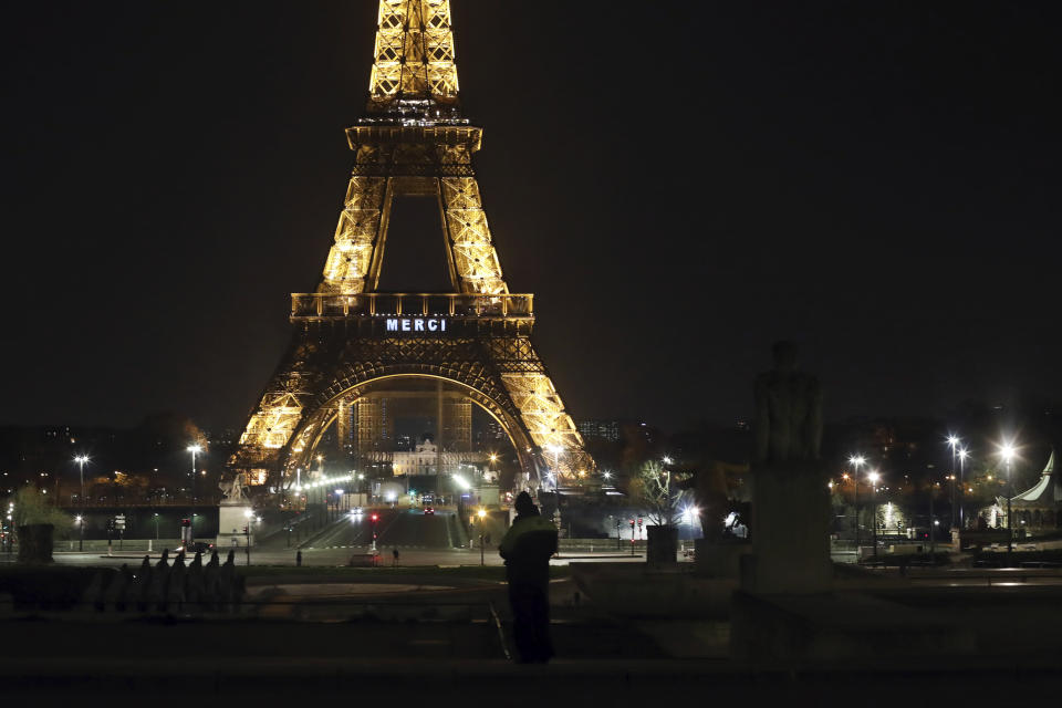 The word "Merci", the French word for 'Thank you", is emblazoned on the Eiffel Tower as France's coronavirus death toll continued to climb, in Paris, Friday, March 27, 2020. Health workers fighting to save lives in France from COVID-19 have received a huge show of gratitude, from the Eiffel Tower. The new coronavirus causes mild or moderate symptoms for most people, but for some, especially older adults and people with existing health problems, it can cause more severe illness or death. (AP Photo/Thibault Camus)