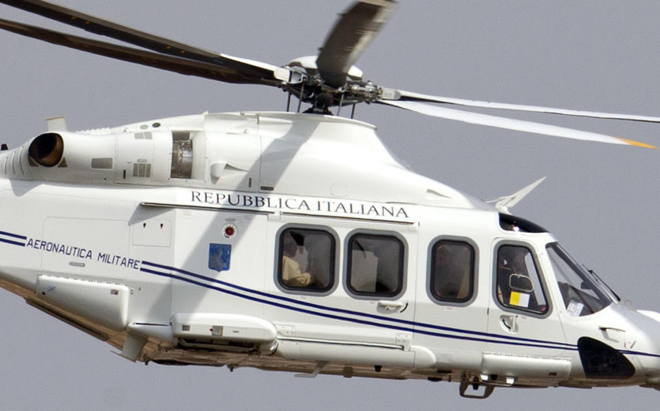 FILE - The helicopter carrying Pope Francis, sitting by the window at left, flies on its way to Castel Gandolfo, south of Rome, on March 23, 2013, to meet with Pope emeritus Benedict XVI, where he has been living since resigning on Feb. 28, 2013. Pope Benedict XVI’s 2013 resignation sparked calls for rules and regulations for future retired popes to avoid the kind of confusion that ensued. Benedict, the German theologian who will be remembered as the first pope in 600 years to resign, has died, the Vatican announced Saturday Dec. 31, 2022. He was 95. (AP Photo/Andrew Medichini, fie)