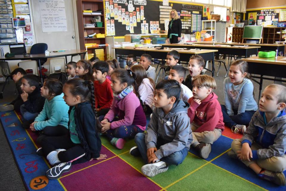 On their first day not being required to wear masks inside school buildings, kindergarten students sound out words in their Beard Elementary classroom in Modesto on Monday, March 14, 2022