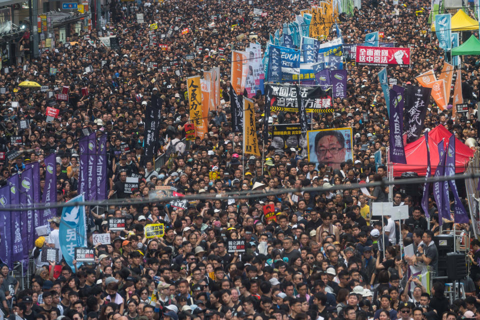HONG KONG, HONG KONG - JULY 01: Protesters take part in a rally against extradition bill on July 1, 2019 in Hong Kong, China. Thousands of pro-democracy protesters faced off with riot police on Monday during the 22nd anniversary of Hong Kong's return to Chinese rule as riot police officers used batons and pepper spray to push back demonstrators. The city's embattled leader Carrie Lam watched a flag-raising ceremony on a video display from inside a convention centre, citing bad weather, as water-filled barricades were set up around the exhibition centre.(Photo by Billy H.C. Kwok/Getty Images)