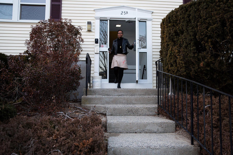 Mona Pompilus leaves her home to go for a walk in Foxborough. (Photo: Kayana Szymczak for Yahoo News)