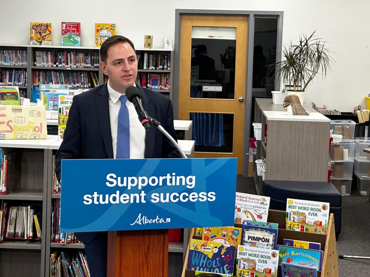 Education Minister Demetrios Nicolaides announces $30 million in extra classroom funding for school divisions with growing enrolment at Holy Child school in Edmonton on Tuesday, Nov. 28, 2023. (Trevor Wilson/CBC - image credit)