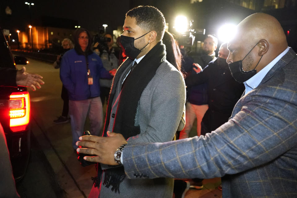 Actor Jussie Smollett, center, leaves the Leighton Criminal Courthouse, Thursday, Dec. 9, 2021, in Chicago, following a verdict in his trial. Smollett was convicted Thursday on five of six charges he staged an anti-gay, racist attack on himself nearly three years ago and then lied to Chicago police about it. (AP Photo/Nam Y. Huh)