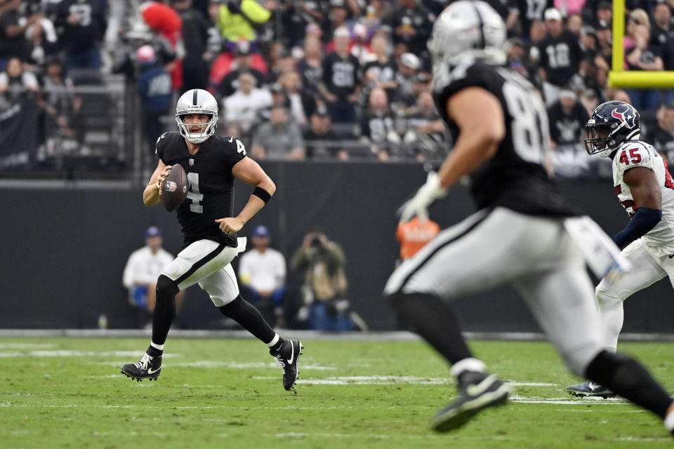 Las Vegas Raiders quarterback Derek Carr scrambles during the second half of an NFL football game against the Houston Texans, Sunday, Oct. 23, 2022, in Las Vegas. (AP Photo/David Becker)