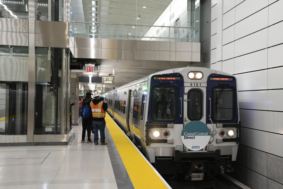 The first Long Island Railroad train to arrive in Grand Central Station slows down as it enters the new annex in New York, Wednesday, Jan. 25, 2023. After years of delays and massive cost overruns, one of the world's most expensive railway projects on Wednesday began shuttling its first passengers between Long Island to a new annex to New York City's iconic Grand Central Terminal. (AP Photo/Seth Wenig)