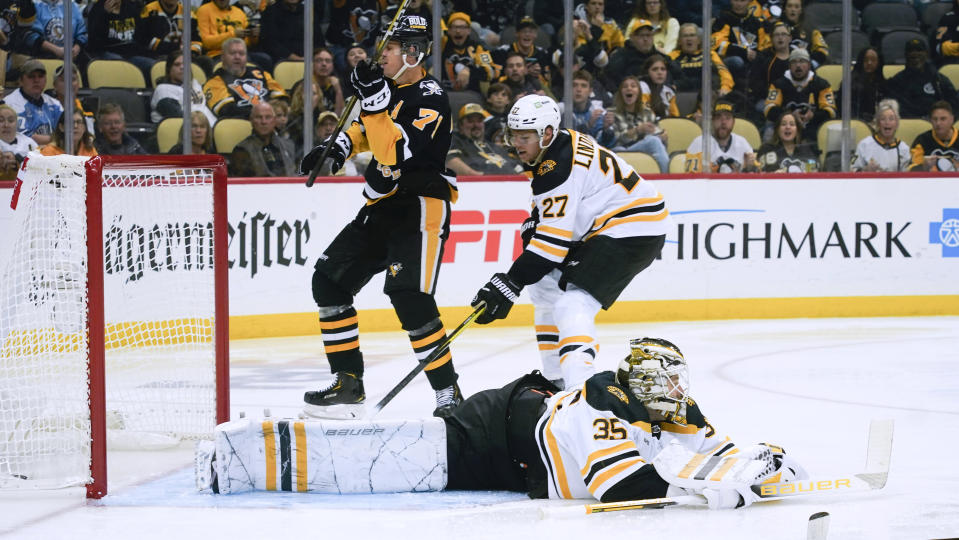 Pittsburgh Penguins' Evgeni Malkin (71) celebrates after scoring on Boston Bruins goaltender Linus Ullmark (35) during the second period of an NHL hockey game Tuesday, Nov. 1, 2022, in Pittsburgh. (AP Photo/Keith Srakocic)