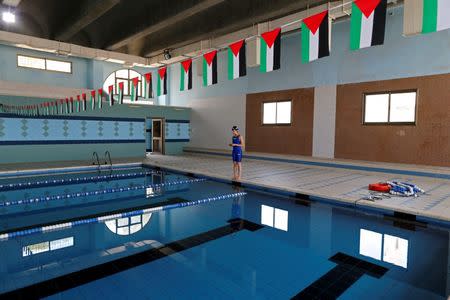 Palestinian swimmer Mary Al-Atrash, 22, who will represent Palestine at the 2016 Rio Olympics, trains in a swimming pool in Beit Sahour, near the West Bank town of Bethlehem June 27, 2016. REUTERS/Ammar Awad