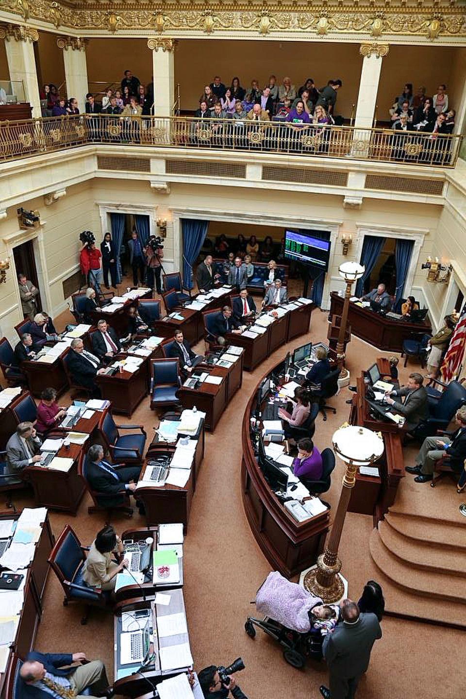 Jeff Nelson and Catrina Nelson bring their daughter Charlee Nelson onto the Senate floor to ask lawmakers to pass Charlee’s Law at the Capitol in Salt Lake City on March 11, 2014. | Courtesy of Catrina Nelson