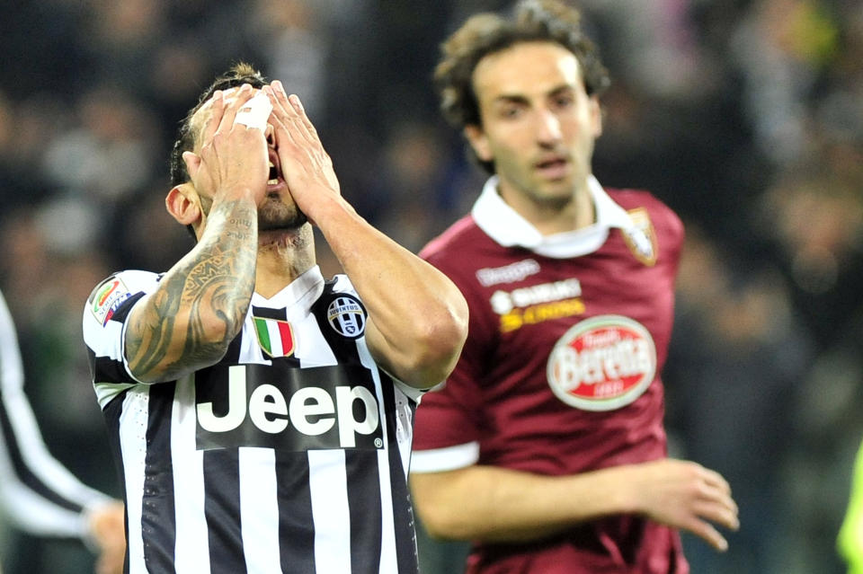 Juventus forward Carlos Tevez, of Argentina, reacts after failing to score during a Serie A soccer match between Juventus and Torino at the Juventus stadium, in Turin, Italy, Sunday, Feb. 23, 2014. (AP Photo/Massimo Pinca)