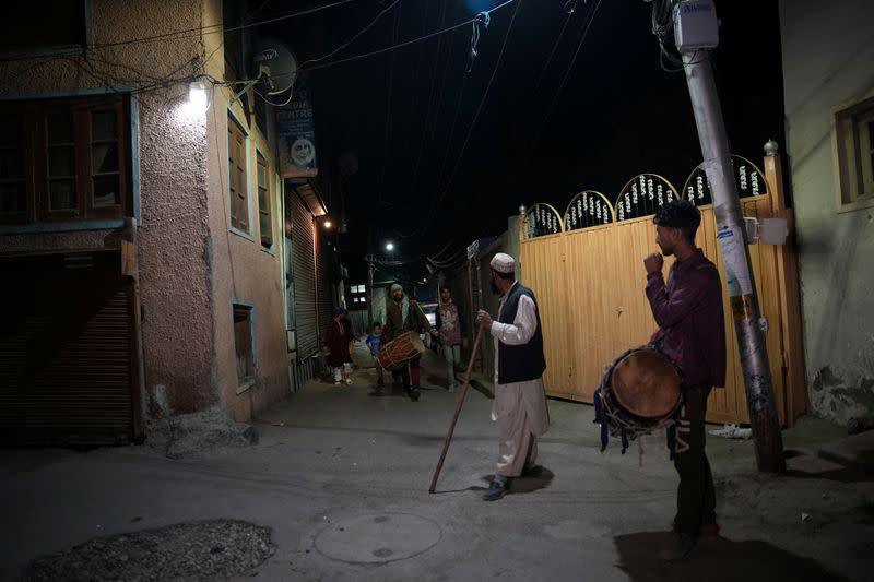 Kashmiri Ramadan drummers wake Muslims up for their meal before daybreak, in Srinagar