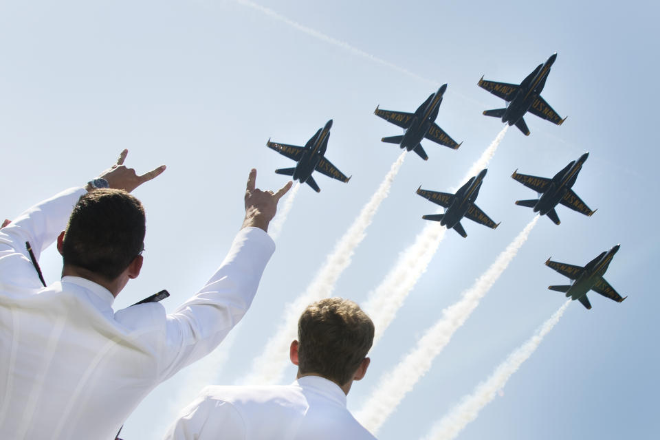 <p>U.S. Naval Academy midshipmen cheer as the U.S. Navy’s Blue Angels fly over the graduation ceremony in Annapolis, Md., on May 25, 2018. (Photo: Jim Watson/AFP/Getty Images) </p>