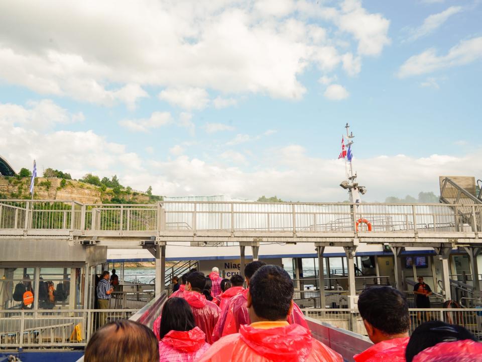 People wait to board the boat