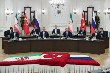 Turkish President Tayyip Erdogan speaks during a meeting with his counterparts Putin of Russia and Rouhani of Iran in Ankara