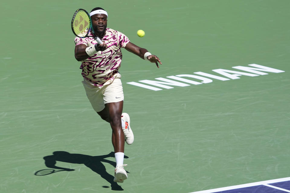 Frances Tiafoe, of the United States, returns a shot against Daniil Medvedev, of Russia, during a semifinal match at the BNP Paribas Open tennis tournament Saturday, March 18, 2023, in Indian Wells, Calif. (AP Photo/Mark J. Terrill)