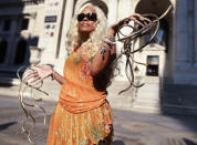 Chris "The Duchess" Walton shows off her Guinness world record holding fingernails outside the New York Public Library in New York September 14, 2011. Her nails measure 10 feet 2 inches on her left hand and 9 feet 7 inches on her right hand that she has been growing for 18 years. REUTERS/Shannon Stapleton