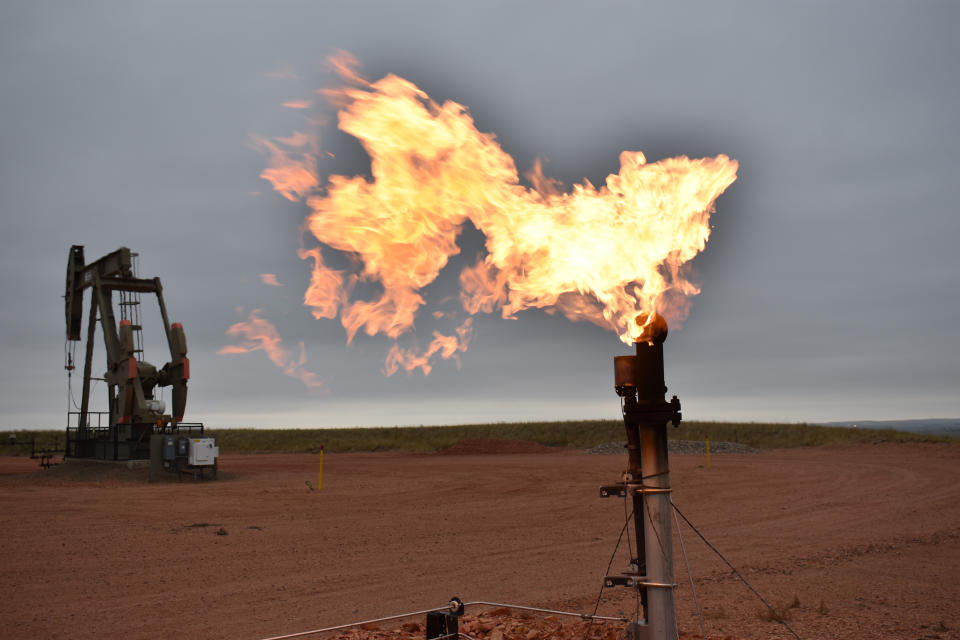 A flare burns natural gas at an oil well Aug. 26, 2021, in Watford City, N.D., part of McKenzie County, the fastest-growing county in the U.S. That's according to new figures from the Census Bureau. (AP Photo/Matthew Brown)