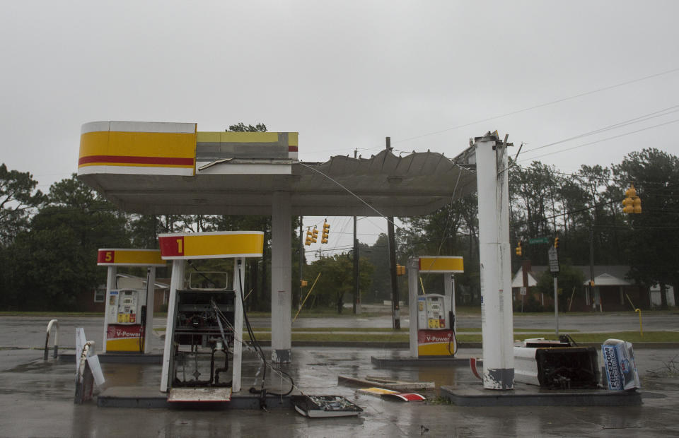 The roof of a gas station is destroyed from strong winds as Hurricane Florence passes over in Wilmington, North Carolina on Friday.