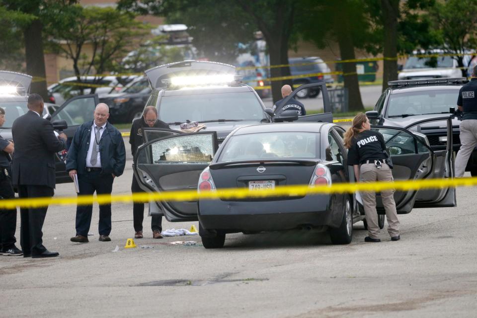 Police officers investigate the scene at Madison Park, near 100th St. and Glendale Ave. on Thursday, June 23, 2016 after Wauwatosa Police Officer Joseph Mensah.shot and killed Jay Anderson Jr.  while the officer was investigating a suspicious car parked at a park on the north end of the city.  