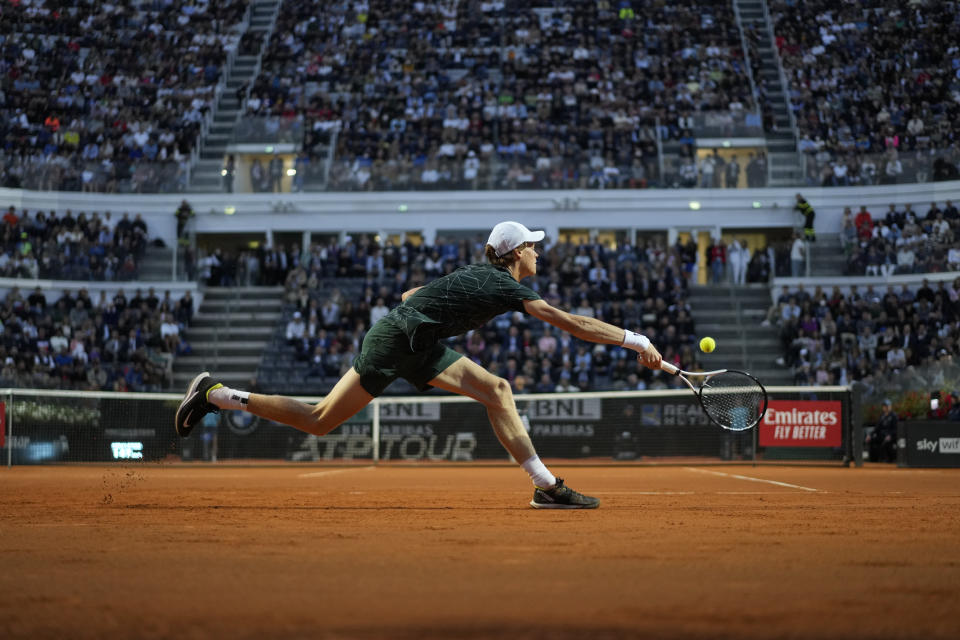 Jannik Sinner returns the ball to Fabio Fognini during their match at the Italian Open tennis tournament, in Rome, Wednesday, May 11, 2022. (AP Photo/Andrew Medichini)