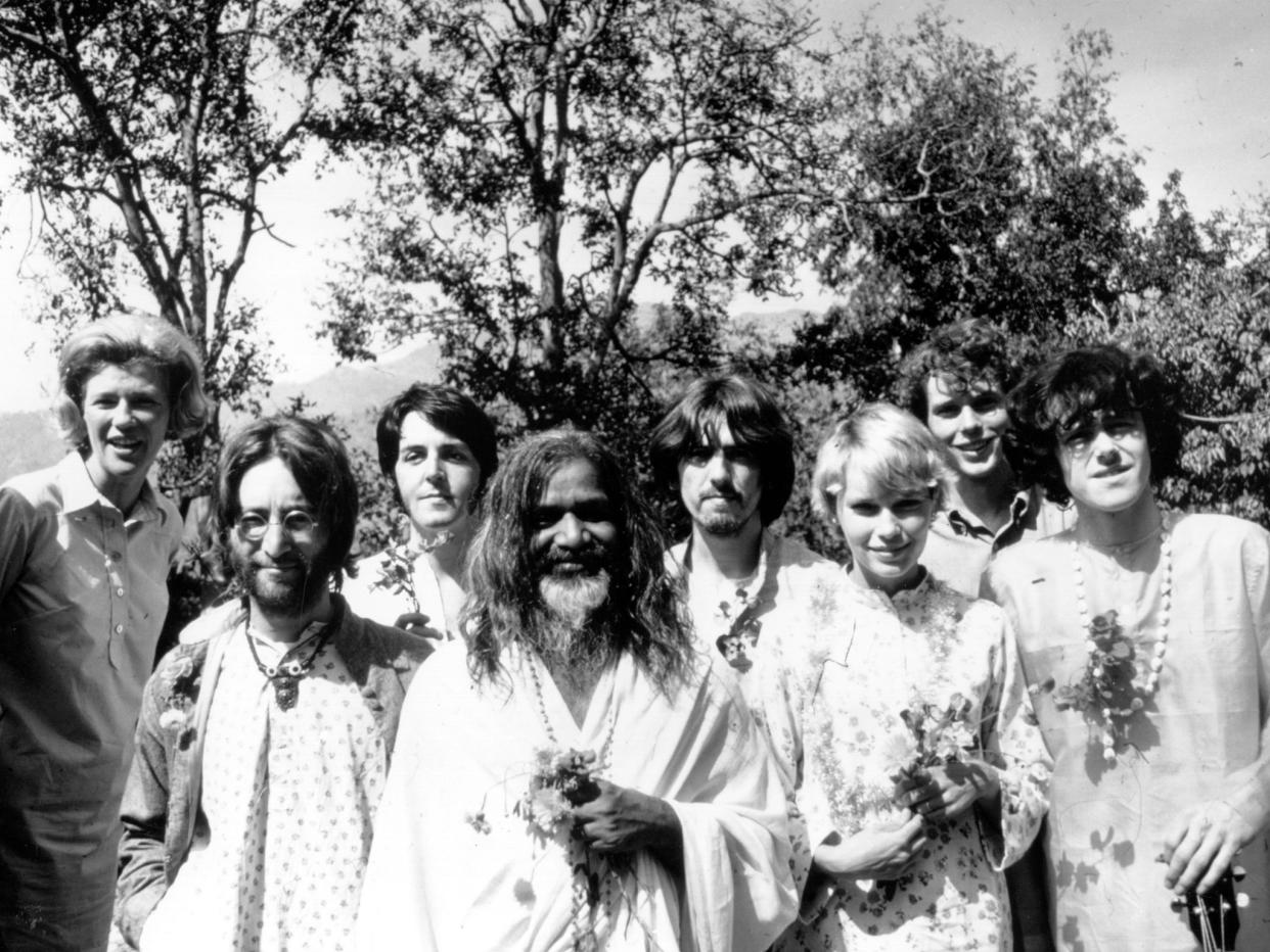 Maharishi Mahesh Yogi with members of the Beatles at his academy in India, March 1968: Getty