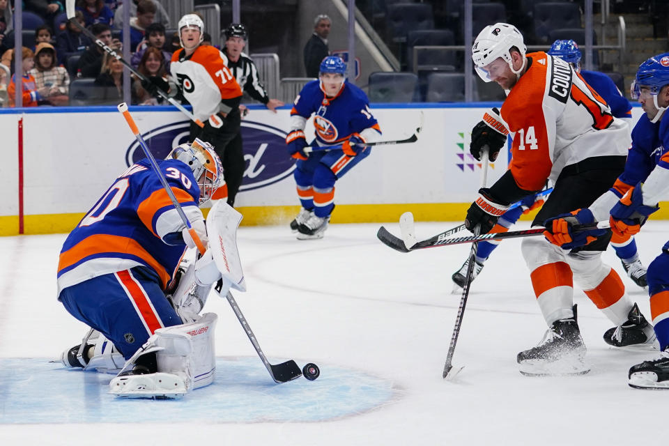 New York Islanders goaltender Ilya Sorokin (30) stops a shot by Philadelphia Flyers' Sean Couturier (14) during the first period of an NHL hockey game Wednesday, Nov. 22, 2023, in Elmont, N.Y. (AP Photo/Frank Franklin II)