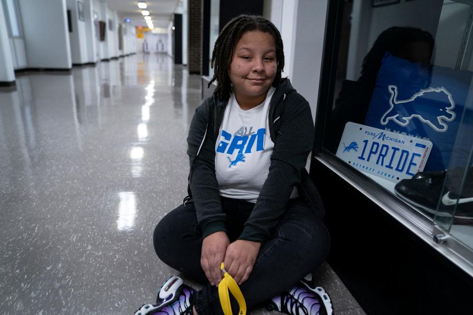 Detroit Lions Academy seventh grader Olivia Elijah, 12, calls her school amazing as she wears her ALL GRIT Lions T-shirt to school Friday, Jan. 26, 2024.