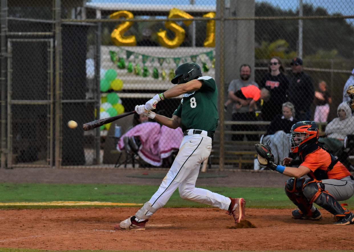 Jupiter's Gabe Graulau makes good contact with a bases-loaded single in the bottom of the sixth inning against Benjamin on April 22, 2024.